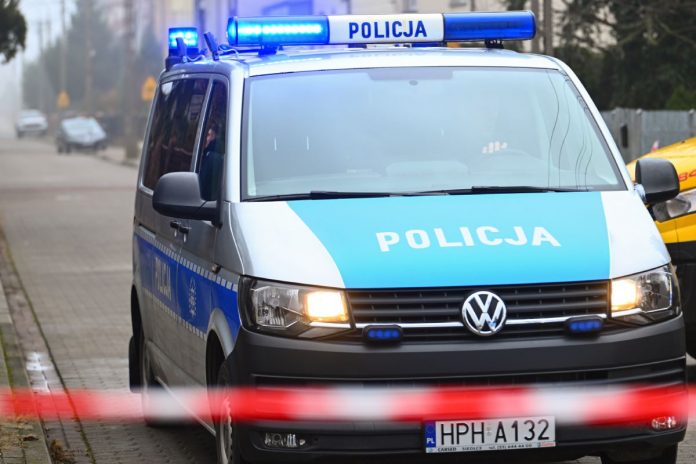 Policja, radiowóz, taśma.