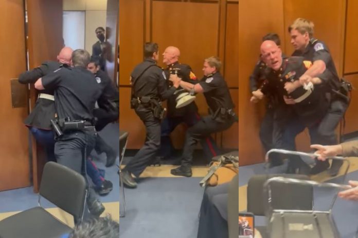 Brian McGinnis usunięty siłą z posiedzenia senackiej komisji.